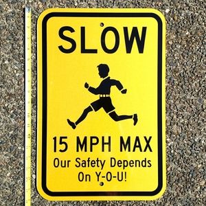 Slow reflective street sign. Aluminum. High visibility. Kids at play.